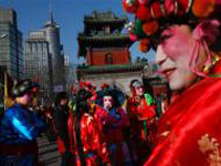 Chinese performers prepare to take part in the entertainment at a temple fair on Chinese New Year in Beijing, China, Monday, Jan. 26, 2009. Temple fairs opened across the city as Chinese celebrate the year of the Ox.
